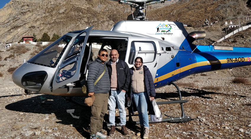 Customer taking picture with helicopter at Muktinath